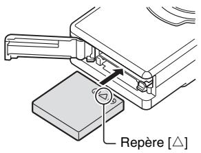 LOGICOM-SANYO XACTI VPC-E7EX - Ouvrez le couvercle du compartiment de la carte/du bloc-pile et insérez le bloc-pile. - 1