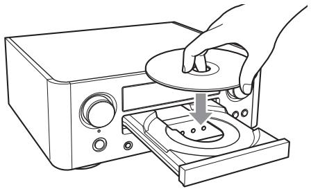 TEAC CR-H500S - Placez un disque sur le plateau avec la face imprimée dirigée vers le haut. - 1