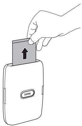 FUJIFILM mini_link - Quand le film a été éjecté (l'imprimante s'arrête en faisant un bruit), tenez le film par le côté puis retirez-le. - 1