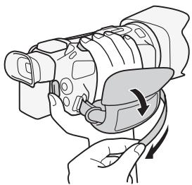 CANON LEGRIA HF G26 - Attachez la sangle de poignée. - 1