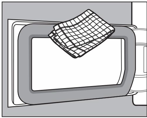 MIELE CTD260WP - Nettoyer la trappe d'accès au filtre socle - 1