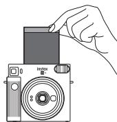 FUJIFILM INSTAX SQ1 TERRACOTTA ORANGE - Mettez l'appareil photo sous tension en tournant la bague de l'objet sur on. - 3