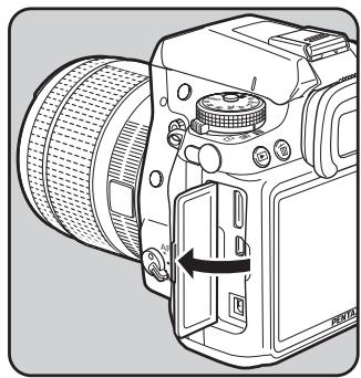 PENTAX K7+DA 18-55MM WR - Utiliser l'adaptateur secteur (en option) - 1