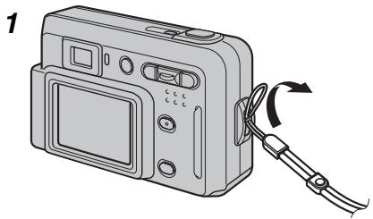 FUJIFILM A510 - Fixez la dragonne comme indiquée en 1 et 2. - 1