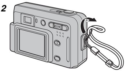 FUJIFILM A510 - Fixez la dragonne comme indiquée en 1 et 2. - 2