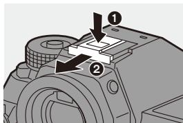 PANASONIC OMe51R - Retrait du couvercle de la griffe porte-accessoires - 1