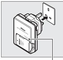 NIKON D130018-55 - Brancher le chargeur. - 1