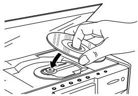 JVC HT-A9C - Placez un disque dans le logement. - 1