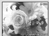 OLYMPUS TOUGH 3000 - Appuyez sur les touches de zoom. - 2