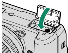 FUJIFILM X-H1 - Fermez le couvercle du compartment de la batterie. - 2