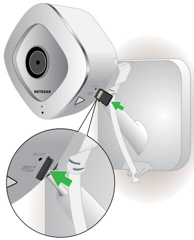 NETGEAR ARLO O4243684 - To insert an SD card in an Arlo Q Plus camera: - 1