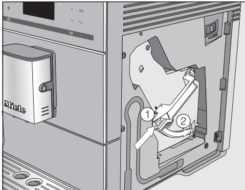 MIELE CM6560NR - Introduire des pastilles de nettoyage dans l'unité de percolation - 2