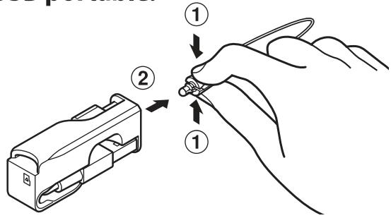 OLYMPUS VN-733+ME-52 - Retirez une couroie du cable USB portable. - 1