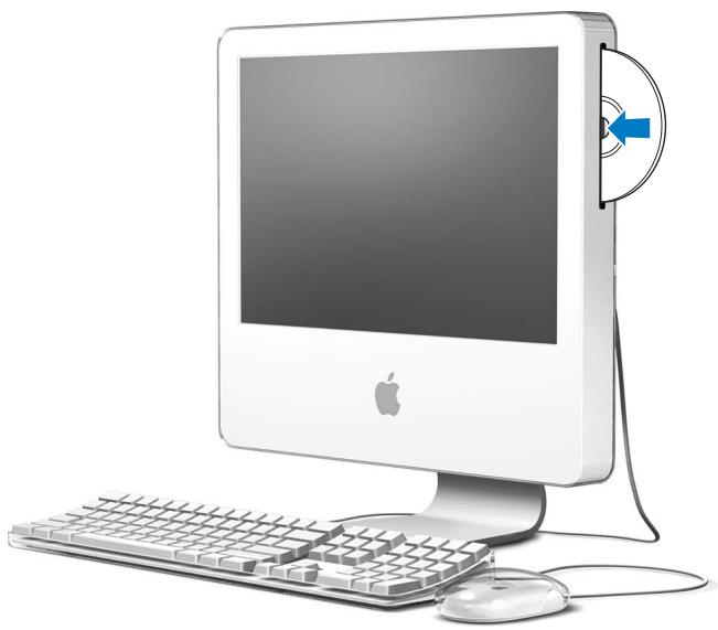 APPLE iMac G5 MADG3F/A - Insertion d'un CD ou DVD - 1