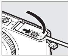 NIKON 1S1BK + 11-27.5 +30-110 - Fermez le volet du logement pour accumulateur/carte mémoire. - 1