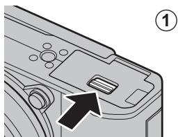 FUJIFILM RiT X-A5+15-45MM - Ouvrez le couvercle du compartment de la batterie. - 1