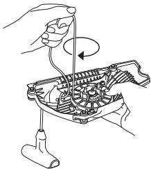 HUSQVARNA 562 XP - Mise sous tension du ressort - 1