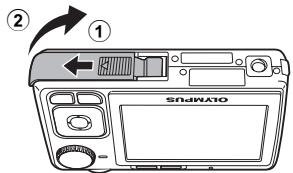 OLYMPUS C520 - b. Вставьте аккумулятор и карту xD-Picture Card (дополнительно). - 1