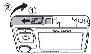 OLYMPUS C520 - b. Insérez la batterie et une xD-Picture Card (en option). - 1