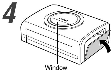 CANON CP-200 - Hold the cassette so that the embossed arrow is at the top, and insert it all the way into the compartment (in the direction of the arrow). - 1