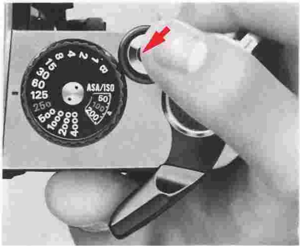 NIKON FM2 - Pull out the film advance lever to unlock the shutter release button ②. - 1