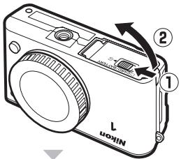NIKON 1 J3 - Insert the battery and a memory card. - 1