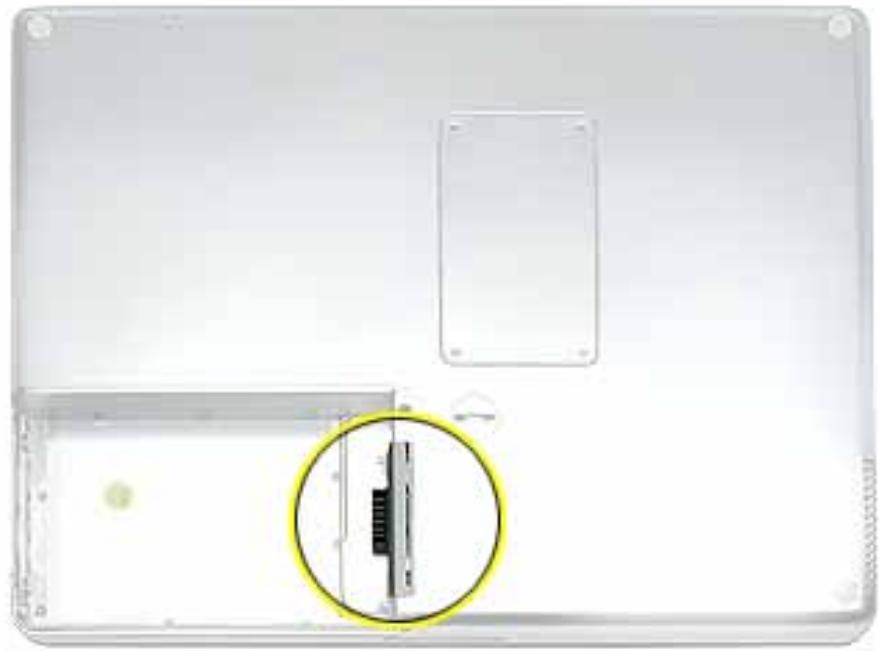APPLE POWERBOOK G4 12 INCH - Open the door to the AirPort slot. (Figure 3) - 1