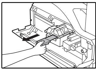 SAGEM MF 9323/ MF 9327 - Remove the tape from the shutter. Pull the shutter out of the toner cartridge as shown in the illustration. - 1