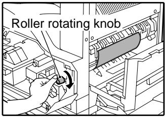 SAGEM MF 9323/ MF 9327 - Turn the roller rotating knob in the direction of the arrow. - 1