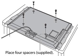 Place four spacers (supplied).