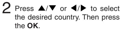 2 Press ▲/▼ or ◀/► to select the desired country. Then press the OK.