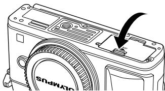 OLYMPUS E-P5 - Closing the battery/card compartment cover. - 1