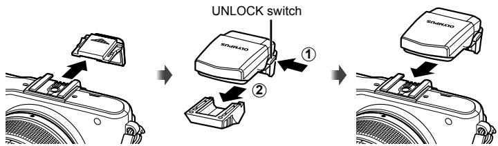 OLYMPUS E-PM1 - Removing the lens from the camera - 2