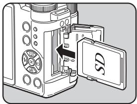 PENTAX Q - Insert the card all the way with the SD Memory Card label facing toward the monitor. - 1