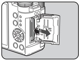 PENTAX Q - Insert the card all the way with the SD Memory Card label facing toward the monitor. - 2