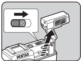 PENTAX Q - Slide the flash pop-up switch in the direction of the arrow. - 1