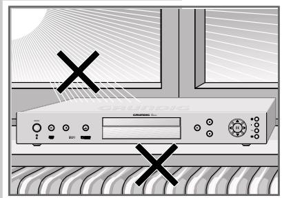 Front view of a CD-ROM device with control buttons and ventilation grilles, marked with black Xs (no readable text or symbols)