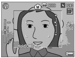 RICOH GR DIGITAL II - Press the buttons to adjust the focus. - 1