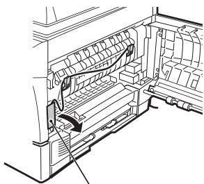 OLIVETTI D-COPIA 120/150 - Remove the adhesive tape from the front cover and remove the two protective pins from the fusing unit by pulling the strings upward one at a time. - 1