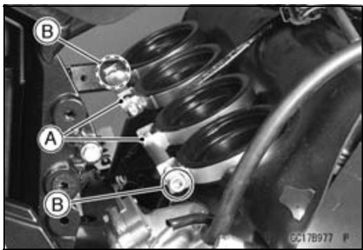 Technical diagram of a vehicle engine with labeled parts A and B, showing mechanical components and structural connections.