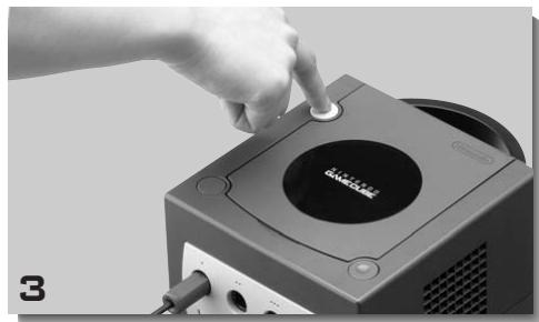 NINTENDO GAMECUBE SYSTEM - REMOVING A GAME DISC - 3