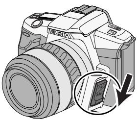 MINOLTA MAXXUM 3 - Slide the focus-mode switch down and release. - 2