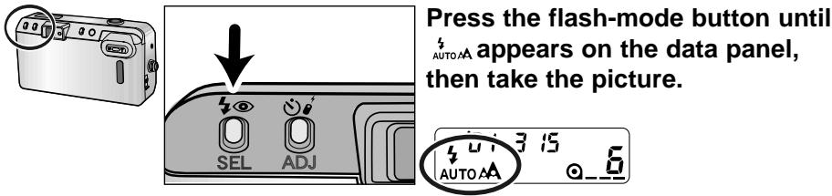 Press the flash-mode button until AUTO AA appears on the data panel, then take the picture.