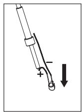Diagram showing a mechanical or electrical component with polarity indicators and an arrow indicating downward motion.