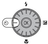NIKON COOLPIX S600 - Press ⚙ (self-timer). - 1