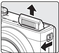 NIKON COOLPIX P300 - Slide the ↘ (flash pop-up) control. - 1