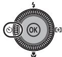 NIKON COOLPIX P7000 - Press (self-timer) on the rotary multi selector. - 1