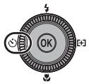 NIKON COOLPIX P7000 - Press (self-timer) on the rotary multi selector. - 1