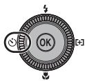 NIKON COOLPIX P7000 - Press (self-timer) on the rotary multi selector. - 1