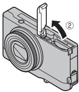FUJIFILM XQ2 - Open the battery-chamber cover. - 2